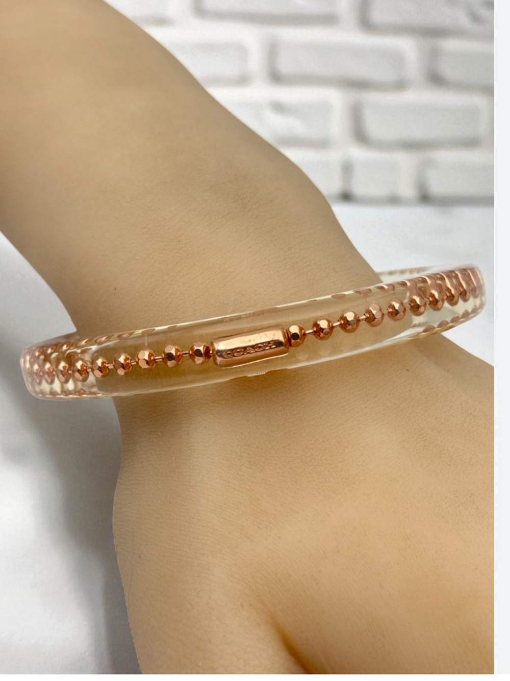 Coach Clear Resin Bangle with Rose Gold Bead Accent